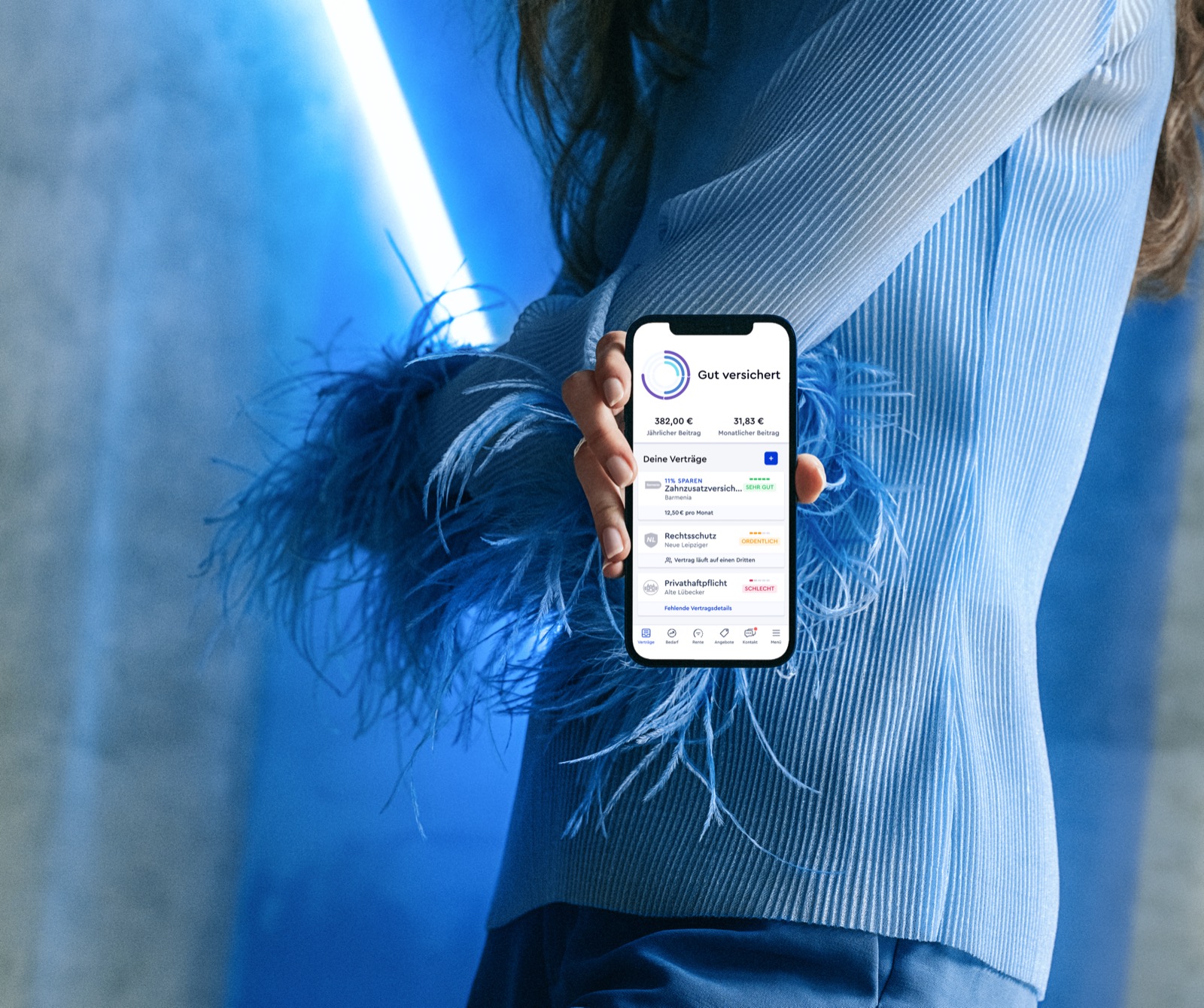 CLARK product photography — close detail of a hand in a blue feathered cuff holding the phone, a blue neon light behind
